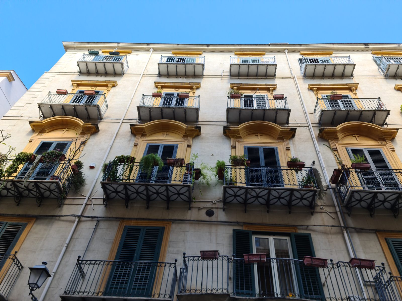 A Palermo palazzo facade — wrought-iron balconies and shutters — Jaco van der Laan, April 2022